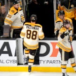 Boston Bruins right wing David Pastrnak (88) leaves the game after being charged with a game misconduct after boarding New York Rangers' Ryan Lindgren during the second period of an NHL hockey game, Saturday, Dec. 16, 2023, in Boston.