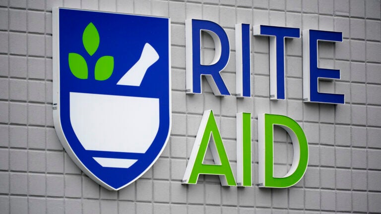 A Rite Aid sign is displayed on the facade of a store in Pittsburgh.