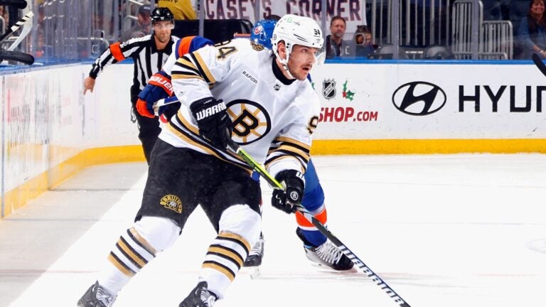 ELMONT, NEW YORK - DECEMBER 15: Jakub Lauko #94 of the Boston Bruins skates against the New York Islanders at UBS Arena on December 15, 2023 in Elmont, New York.