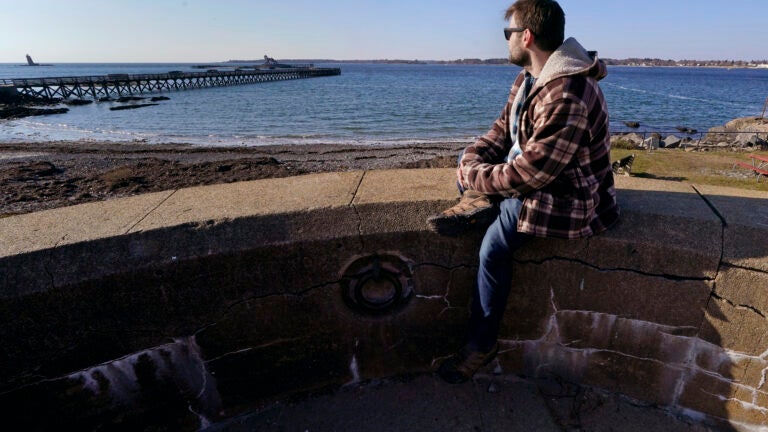 Jacob looks out towards the sea at Fort Foster in Kittery Point, Maine.