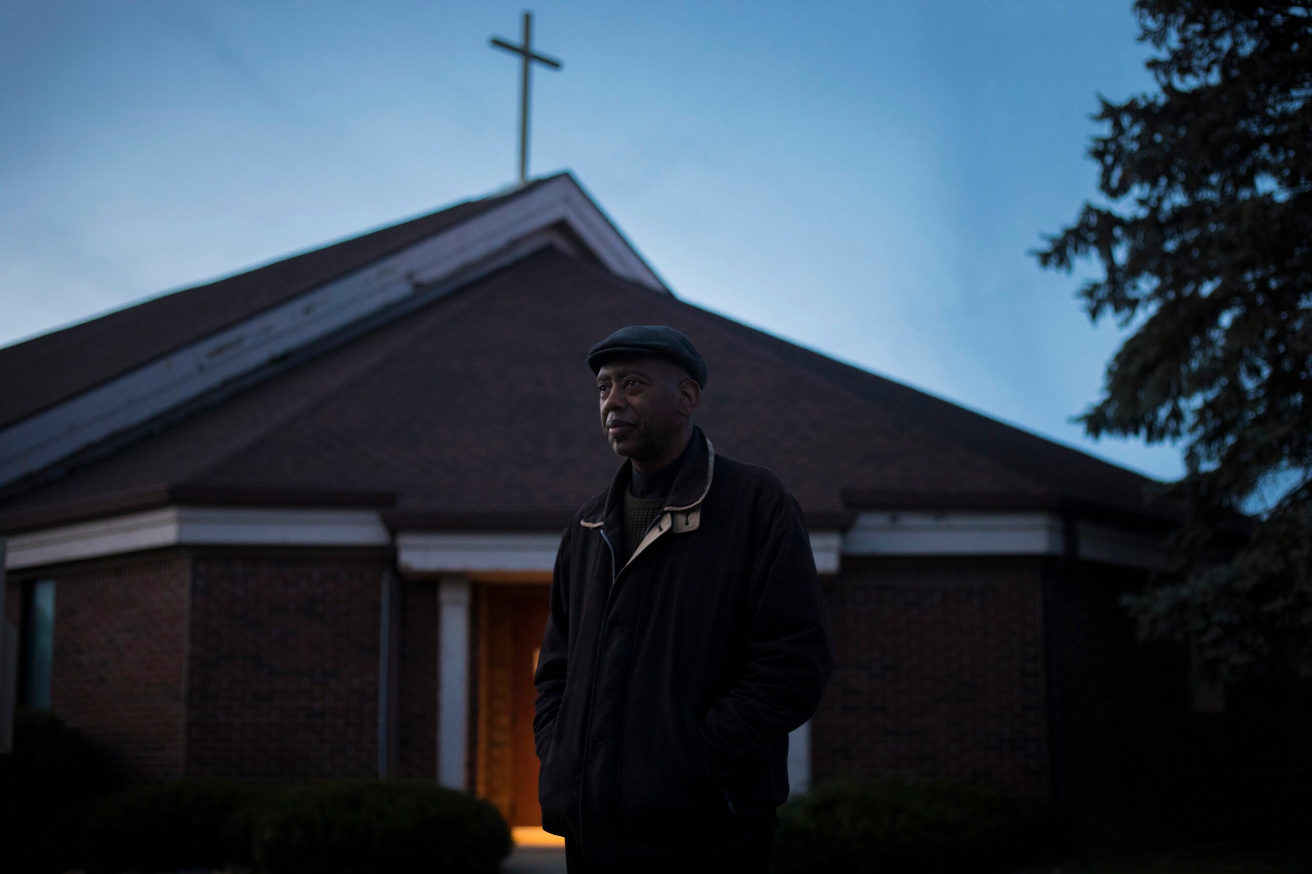 Rev. Charles Harrison, who leads the Indianapolis Ten Point Coalition, stands outside Barnes United Methodist Church in Indianapolis. 