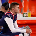 New England Patriots quarterback Bailey Zappe (4) sits on the bench after failing to convert on fourth down late in the second half. The Chiefs defeat the Patriots, 27-17, at Gillette Stadium.