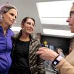 From left, Rebecca Plaut Mautner, Faiza Khan, and Jen Wofford chat. People of several faiths gather at the public library in Coolidge Corner to share support for Palestinians and Israelis.