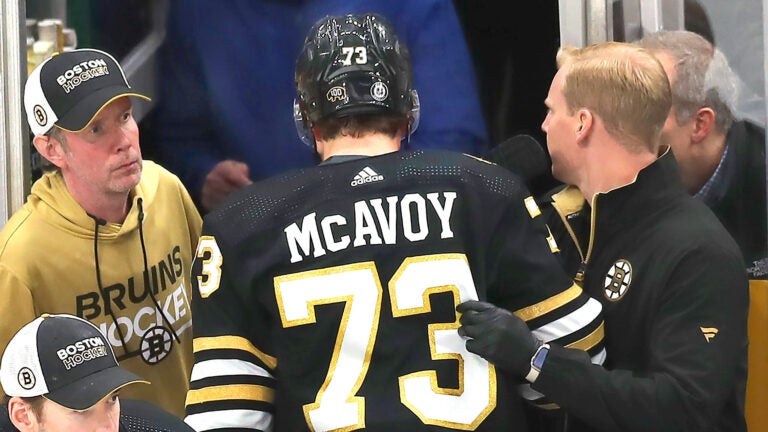 Boston Bruins defenseman Charlie McAvoy heads to the locker room after after a 3rd period collision with Sabres JJ Peterka. He left the game.