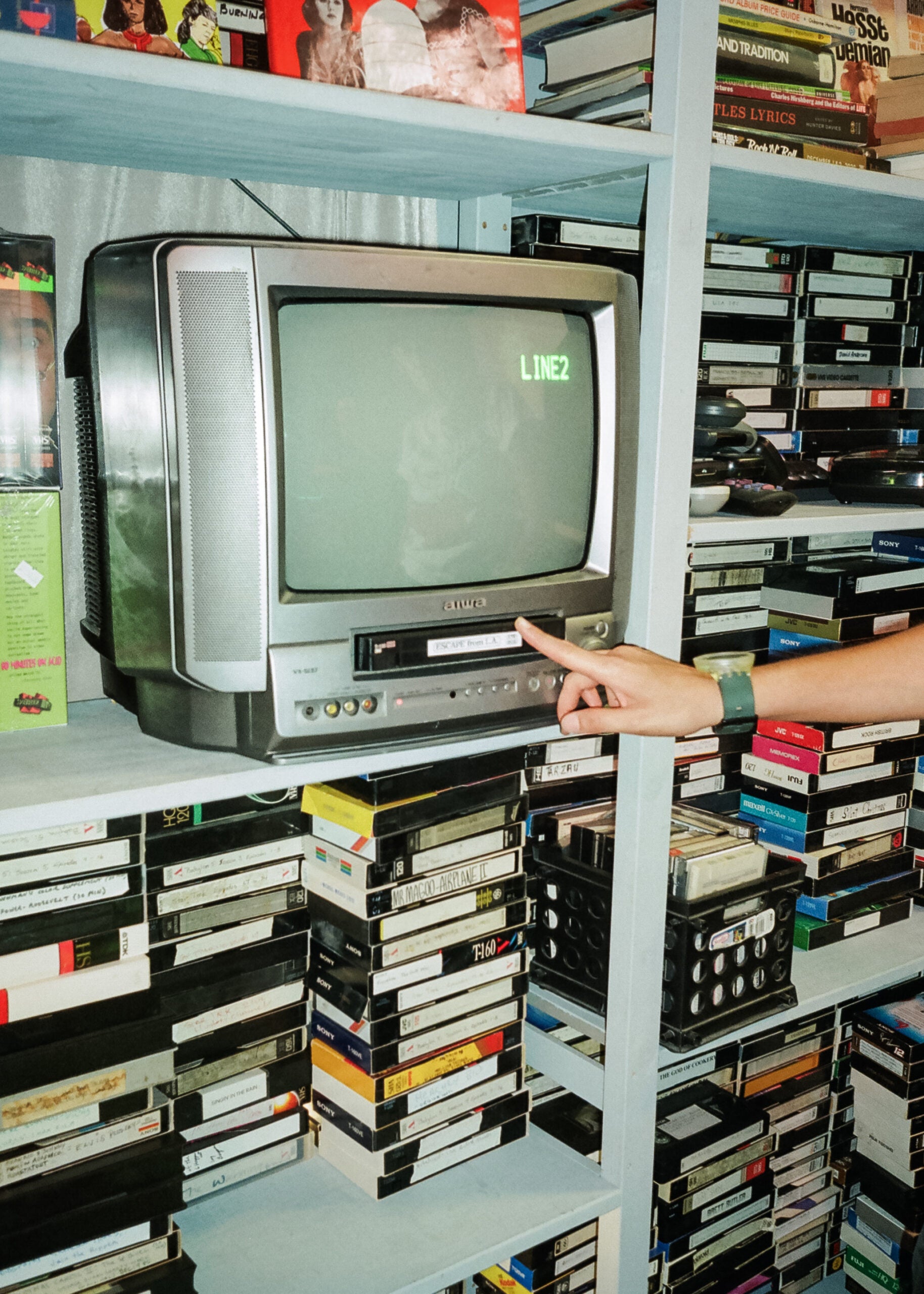 Whammy! founder Jessica Gonzales loads one of many VCR TVs at the used tape shop in Echo Park.