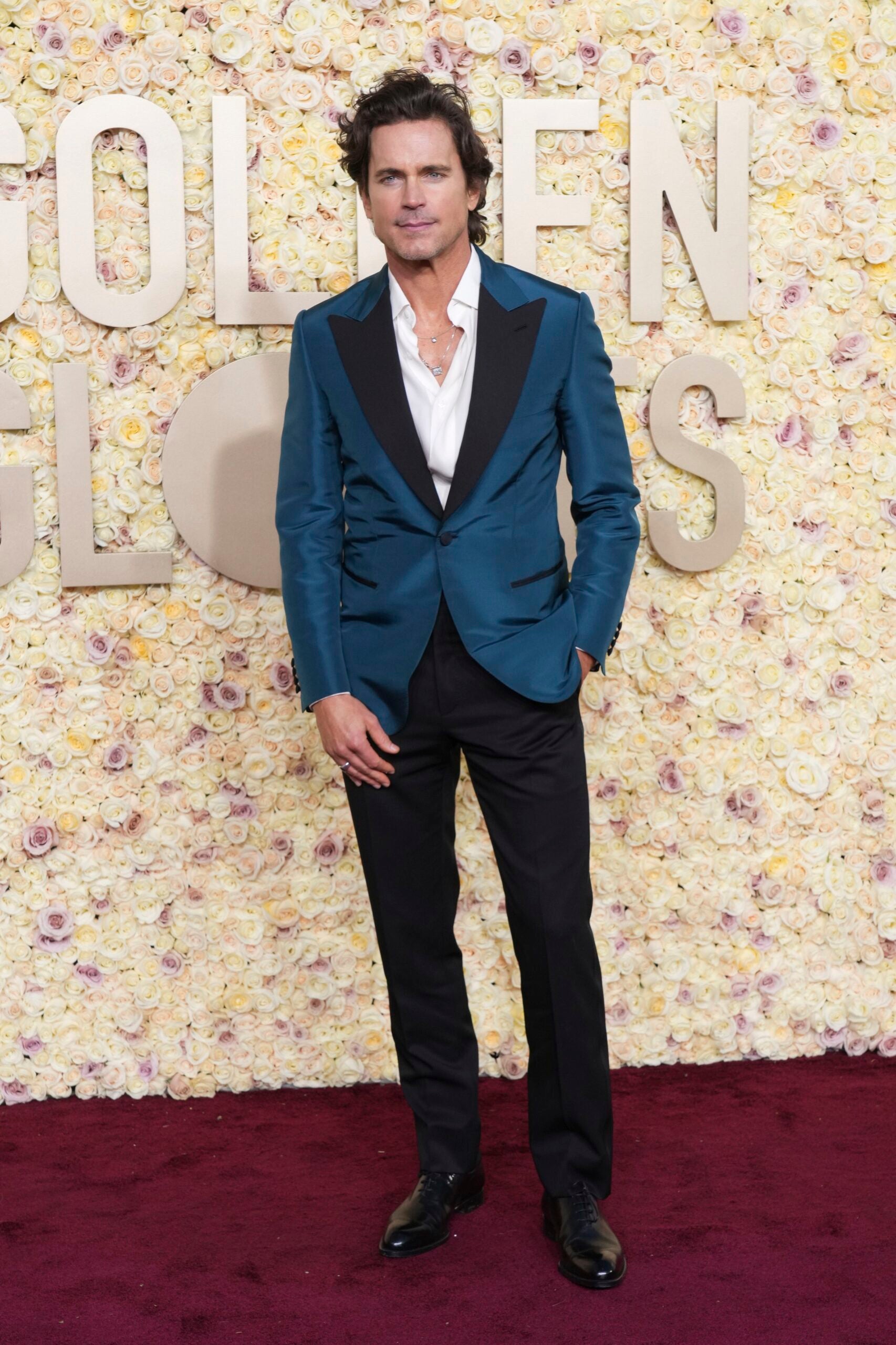 Matt Bomer arrives at the 2024 Golden Globes red carpet.