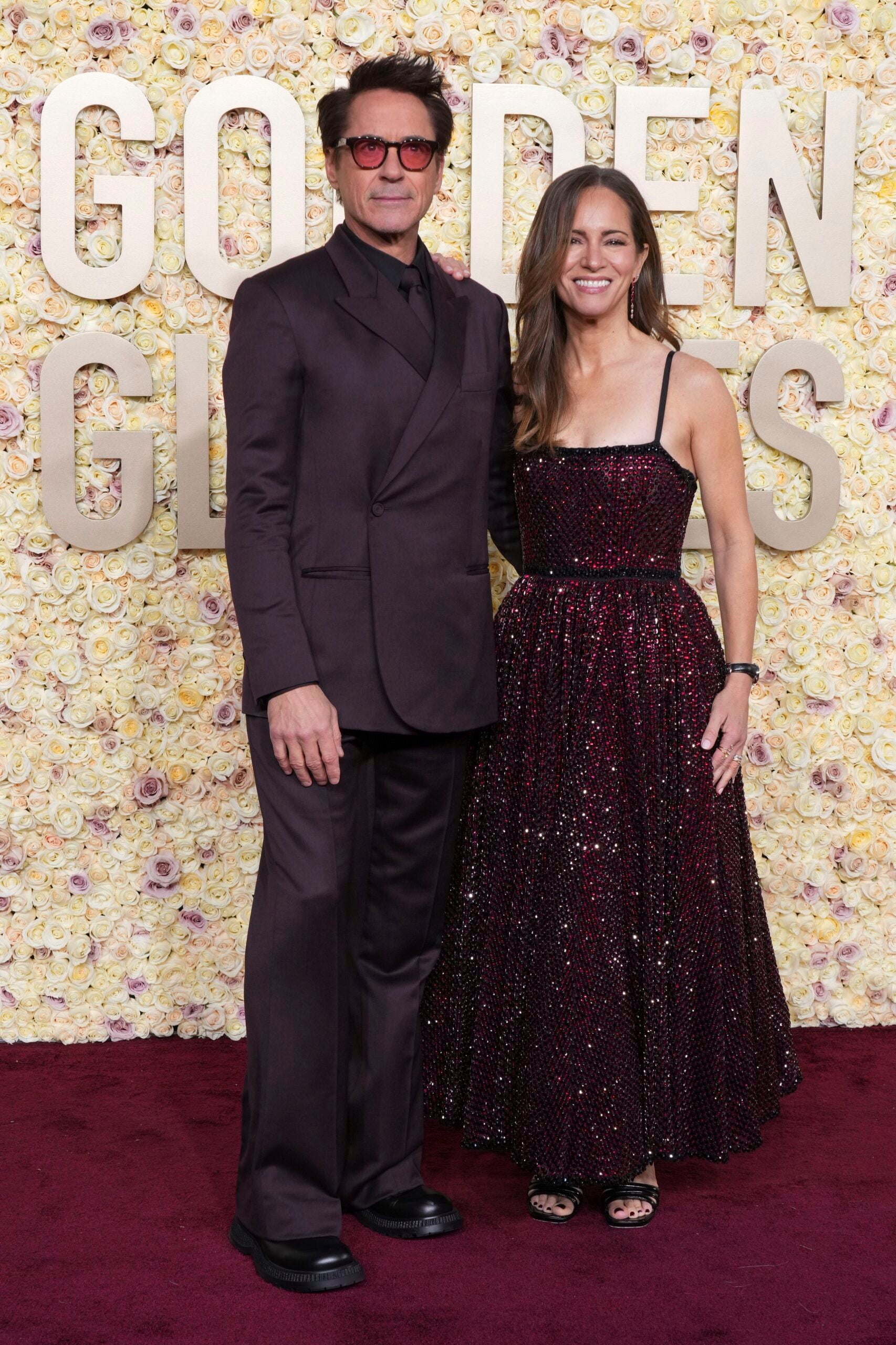 Robert Downey Jr. and Susan Downey arrive at the 2024 Golden Globes red carpet.