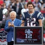 FOXBOROUGH, MASSACHUSETTS - SEPTEMBER 10: New England Patriots President Jonathan Kraft, New England Patriots owner Robert Kraft watch as former New England Patriots quarterback Tom Brady speaks during a ceremony honoring Brady at halftime of New England's game against the Philadelphia Eagles at Gillette Stadium on September 10, 2023 in Foxborough, Massachusetts.