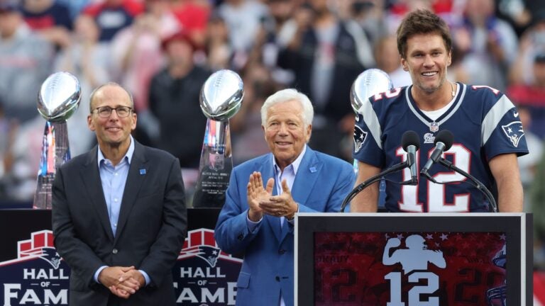 FOXBOROUGH, MASSACHUSETTS - SEPTEMBER 10: New England Patriots President Jonathan Kraft, New England Patriots owner Robert Kraft watch as former New England Patriots quarterback Tom Brady speaks during a ceremony honoring Brady at halftime of New England's game against the Philadelphia Eagles at Gillette Stadium on September 10, 2023 in Foxborough, Massachusetts.