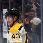 BOSTON, MASSACHUSETTS - JANUARY 20: Danton Heinen #43 of the Boston Bruins celebrates after scoring a hat trick goal against the Montreal Canadiens during the third period at TD Garden on January 20, 2024 in Boston, Massachusetts. The Bruins defeat the Canadiens 9-4.
