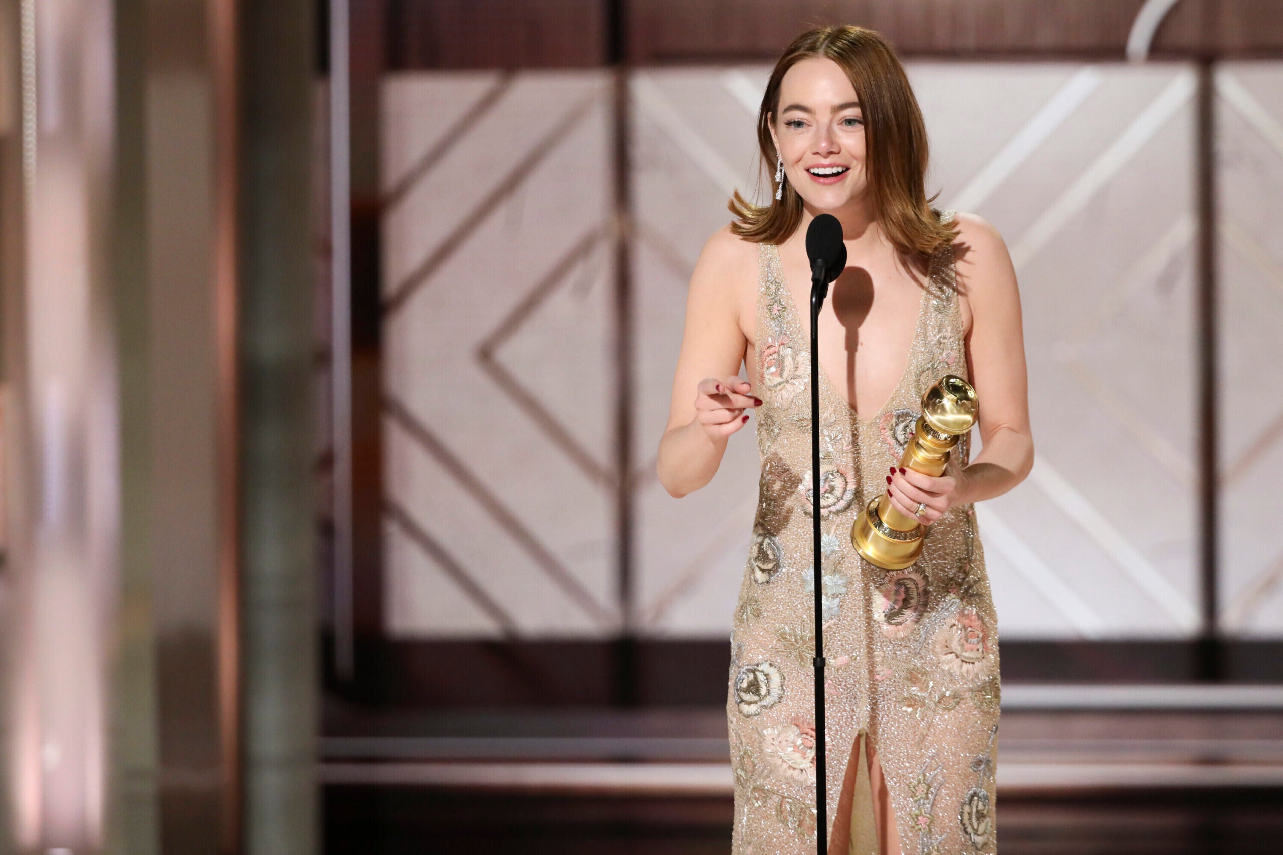 Emma Stone accepting the award for best female actor in a motion picture for her role in "Poor Things."  