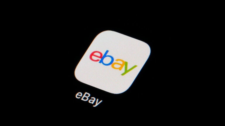 The eBay app icon is seen on a smartphone.