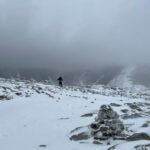 Conservation Officer Christopher McKee stands on Mount Guyot in Grafton County, N.H.