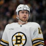 Boston Bruins center Johnny Beecher (19) in the first period of an NHL hockey game Monday, Jan. 8, 2024, in Denver.