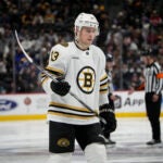 Boston Bruins center Charlie Coyle (13) in the third period of an NHL hockey game Monday, Jan. 8, 2024, in Denver.