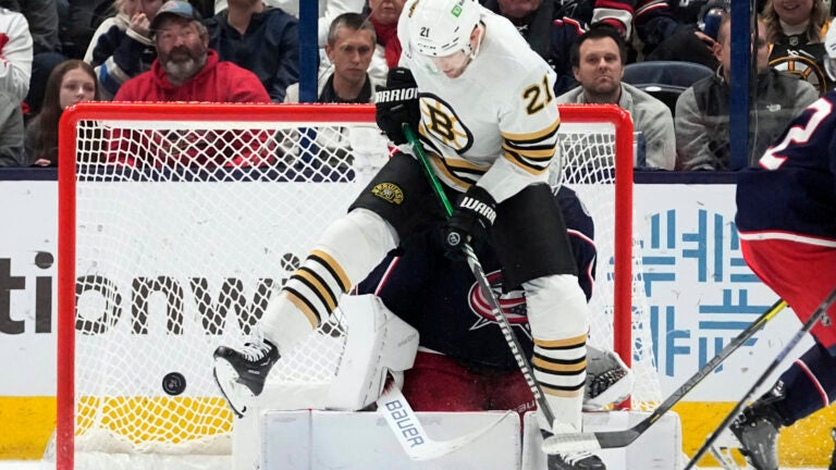 Boston Bruins left wing James van Riemsdyk jumps out of the way of a shot in front of Columbus Blue Jackets goaltender Spencer Martin in the second period.