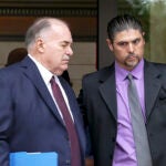 Gino DiGiovanni Jr., right, and his attorney, Martin Minnella, walk out of the federal courthouse in New Haven, Conn.