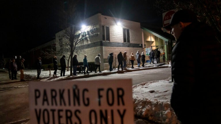Voters enter a youth center to cast their ballots.