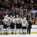 TEMPE, ARIZONA - JANUARY 09: Goaltender Linus Ullmark #35 of the Boston Bruins is helped off the ice by Jake DeBrusk #74 and Kevin Shattenkirk #12 after an injury in overtime against the Arizona Coyotes at Mullett Arena on January 09, 2024 in Tempe, Arizona. The Coyotes defeated the Bruins 4-3 in overtime.