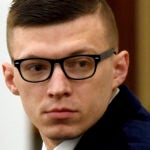 Volodymyr Zhukovskyy looks back at the gallery.