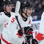 Canada's forward Matthew Poitras (C) reacts after scoring the 0-10 goal during the Group A ice hockey match between Latvia and Canada of the IIHF World Junior Championship in Gothenburg, Sweden on December 27, 2023.