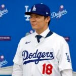 LOS ANGELES, CALIFORNIA - DECEMBER 27: Yoshinobu Yamamoto poses for a photo during an introductory press conference at Dodger Stadium on December 27, 2023 in Los Angeles, California.