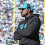Carolina Panthers outside linebackers coach Tem Lukabu walks the sidelines before an NFL football game against the Jacksonville Jaguars, Sunday, Dec. 31, 2023, in Jacksonville, Fla.