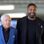 New England Patriots owner Robert Kraft, left, and newly-named Patriots head coach Jerod Mayowalk together Wednesday, Jan. 17, 2024, as they arrive at an NFL football news conference, in Foxborough, Mass. Mayo succeeds Bill Belichick as the franchise's 15th head coach.