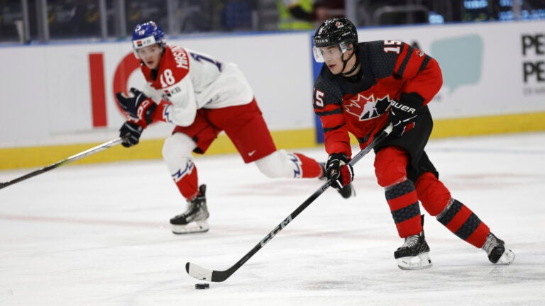 Canada's Matthew Poitras, right, and Czech Republic's Matej Mastalirsky in action during the IIHF World Junior Championship ice hockey quarterfinal match between Canada and Czech Republic at Scandinavium in Gothenburg, Sweden, Tuesday, Jan. 2, 2024.
