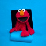 FILE - In this Jan. 24, 2011, file photo, Elmo poses for a portrait in the Fender Music Lodge during the 2011 Sundance Film Festival in Park City, Utah.