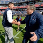 In this Nov. 11, 2018, file photo, Tennessee Titans head coach Mike Vrabel, left, greets New England Patriots head coach Bill Belichick before an NFL football game in Nashville, Tenn. The Titans and Patriots will meet in a wild-card matchup on Saturday, Jan. 4, 2020.
