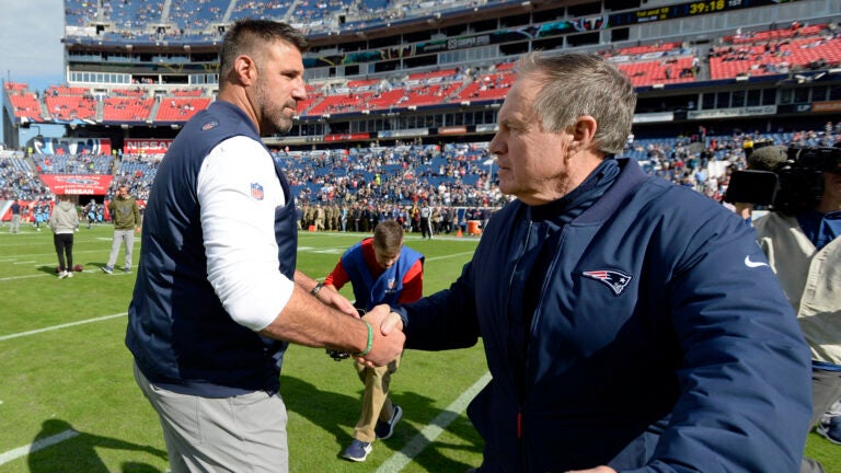 In this Nov. 11, 2018, file photo, Tennessee Titans head coach Mike Vrabel, left, greets New England Patriots head coach Bill Belichick before an NFL football game in Nashville, Tenn. The Titans and Patriots will meet in a wild-card matchup on Saturday, Jan. 4, 2020.