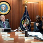 In this image provided by The White House, President Joe Biden receives the Presidential Daily Briefing, Monday, Jan. 29, 2024, in the White House Situation Room at the White House in Washington, as Defense Secretary Lloyd Austin listens.
