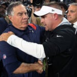 Patriots head coach Bill Belichick (left) and Raiders head coach Josh McDaniels are pictured as htey met on ther field following the last second Las Vegas victory. The New England Patriots visited the Las Vegas Raiders for a regular season NFL football game at Allegiant Stadium.