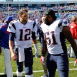 New England Patriots Tom Brady (12) and Jerod Mayo (51) walk from the field after their NFL football game against the Buffalo Bills Sunday, Sept. 8, 2013, in Orchard Park. The Patriots won the game 23-21.