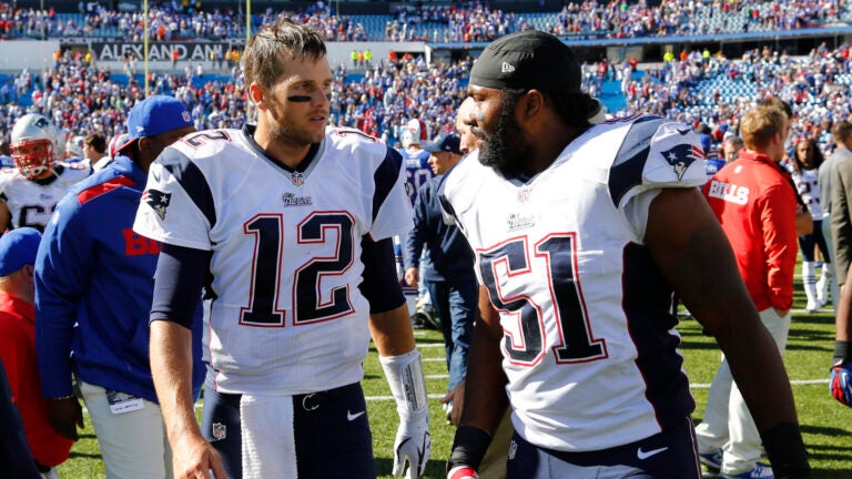 New England Patriots Tom Brady (12) and Jerod Mayo (51) walk from the field after their NFL football game against the Buffalo Bills Sunday, Sept. 8, 2013, in Orchard Park. The Patriots won the game 23-21.