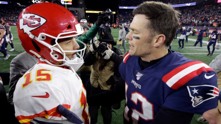 Kansas City Chiefs quarterback Patrick Mahomes, left, and New England Patriots quarterback Tom Brady speak at midfield after an NFL football game, Sunday, Dec. 8, 2019, in Foxborough, Mass.