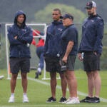 New England Patriots head coach Bill Belichick with Joe Mazzulla (second from left) head coach of the Celtics during training camp on the Gillette Stadium practice field.