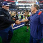 New England Patriots head coach Bill Belichick shaking hands with Dallas Cowboys head coach Mike McCarthy after the Cowboys defeated the Patriots during NFL action.