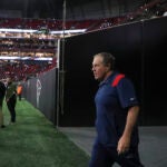 New England Patriots Bill Belichick leading his team on to the field before they play the Atlanta Falcons during NFL action at Mercedes-Benz Stadium.