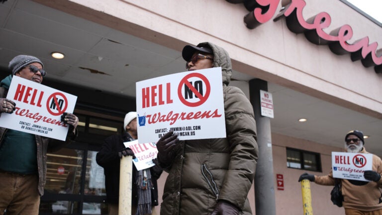 Protesters outside of a Walgreens in Roxbury that has plans to close.