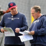 The Patriots held practice at the practice field at Gillette Stadium. Head coach Bill Belichick(right) goes over paperwork with Bill O’Brien.