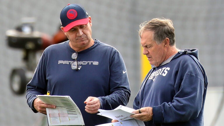 The Patriots held practice at the practice field at Gillette Stadium. Head coach Bill Belichick(right) goes over paperwork with Bill O’Brien.