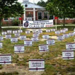 Signs displaying student names in the Town Green in Pembroke.