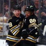 BOSTON, MASSACHUSETTS - FEBRUARY 29: Morgan Geekie #39 of the Boston Bruins celebrates with David Pastrnak #88 after scoring his second goal of the game against the Vegas Golden Knights during the first period at TD Garden on February 29, 2024 in Boston, Massachusetts.