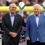 FOXBOROUGH, MASSACHUSETTS - SEPTEMBER 10: New England Patriots President Jonathan Kraft and New England Patriots owner Robert Kraft speaks during a ceremony honoring former New England Patriots quarterback Tom Brady at halftime of New England's game against the Philadelphia Eagles at Gillette Stadium on September 10, 2023 in Foxborough, Massachusetts.