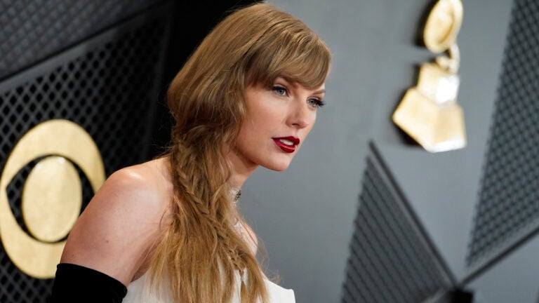 Taylor Swift arrives at the 66th annual Grammy Awards.