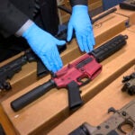 "Ghost guns" are displayed at the headquarters of the San Francisco Police Department.