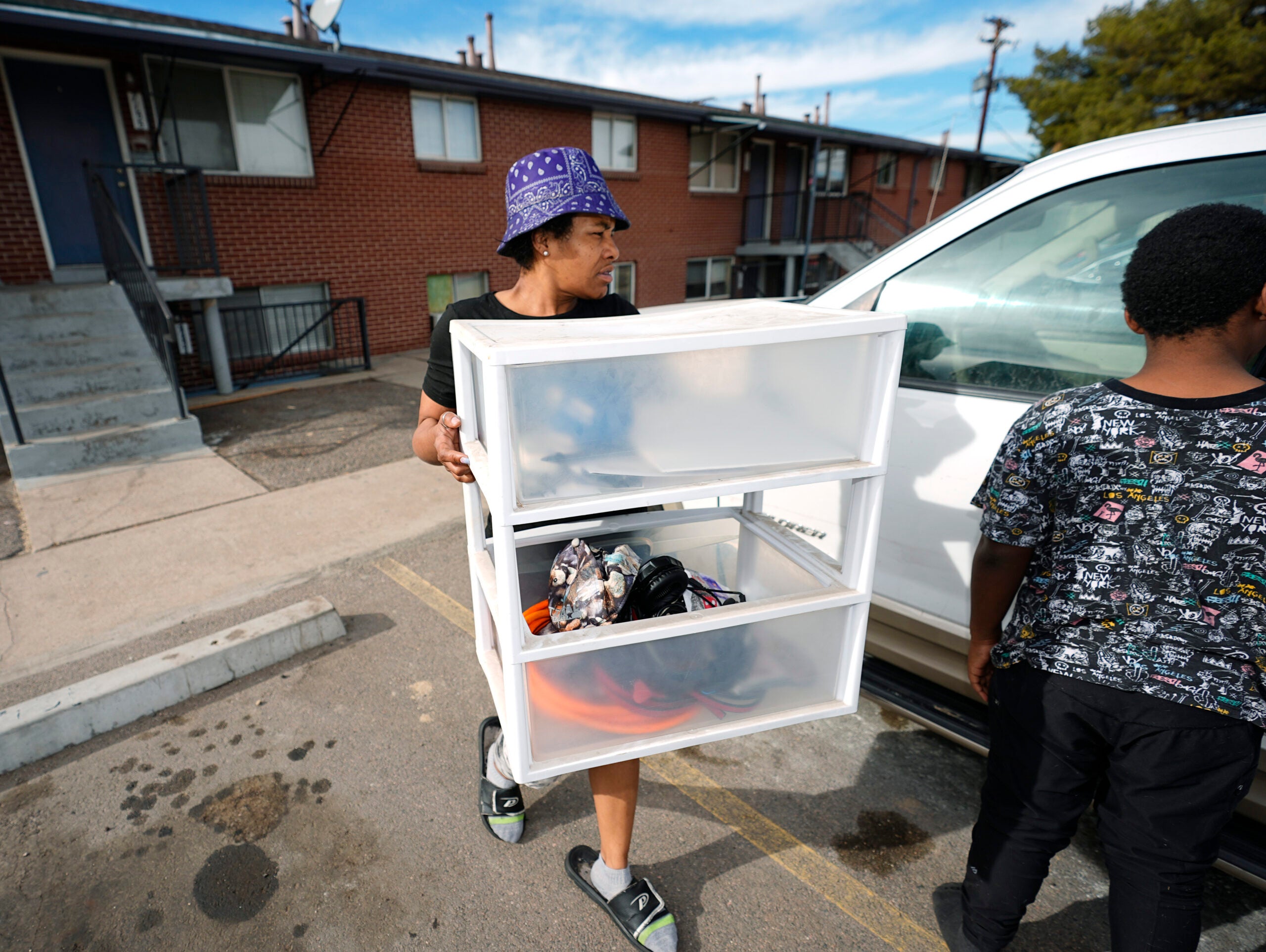 Monique Grant moves belongings out of an apartment. 