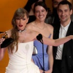 Taylor Swift accepts the award for album of the year for "Midnights."